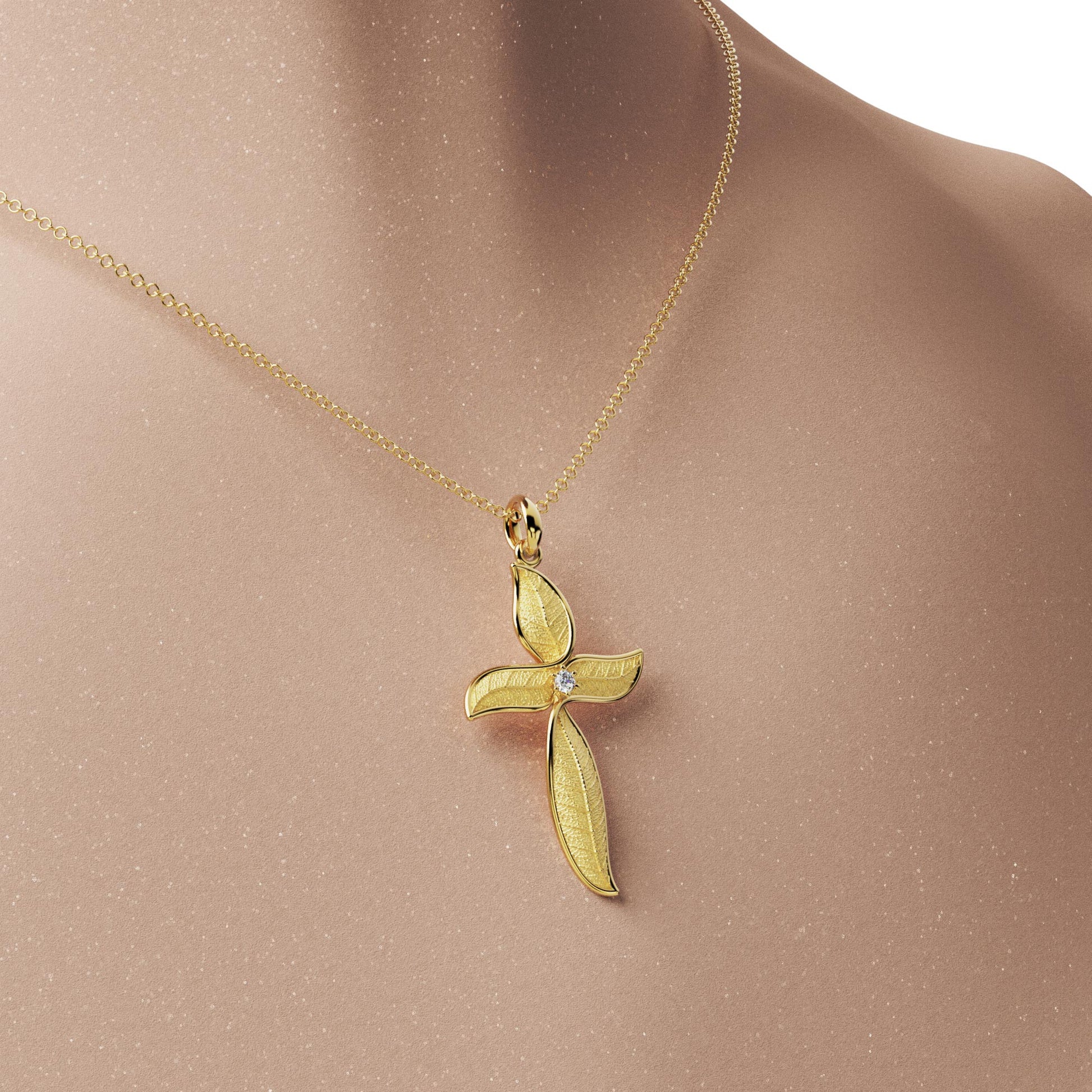 Leaf shaped nature inspired gold cross pendant necklace with natural diamond