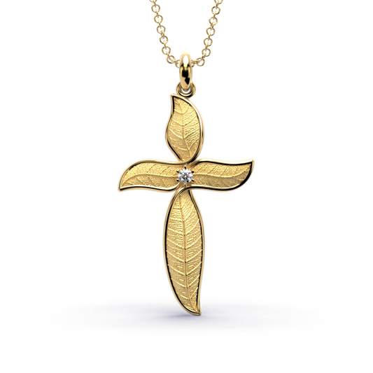 Leaf shaped nature inspired gold cross pendant necklace with natural diamond