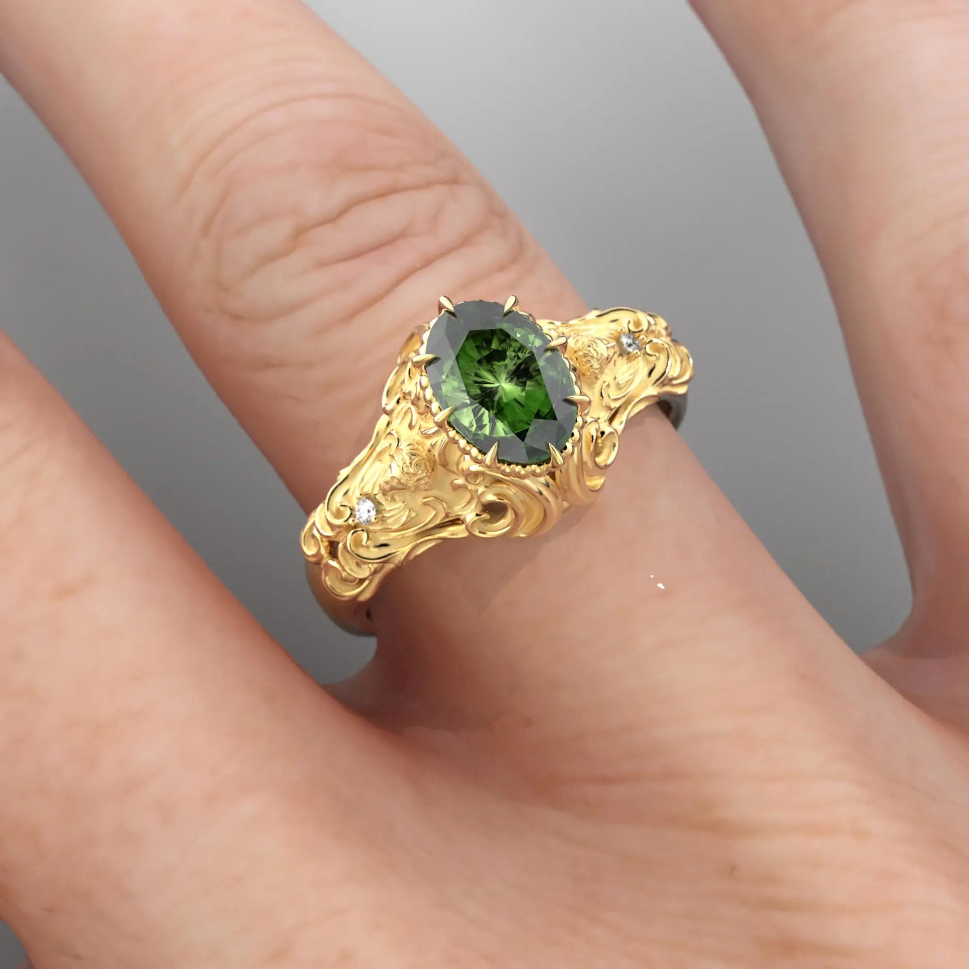 Hand wearing a green sapphire ring in yellow gold, illustrating the ring's fit and the brilliance of the sapphire.