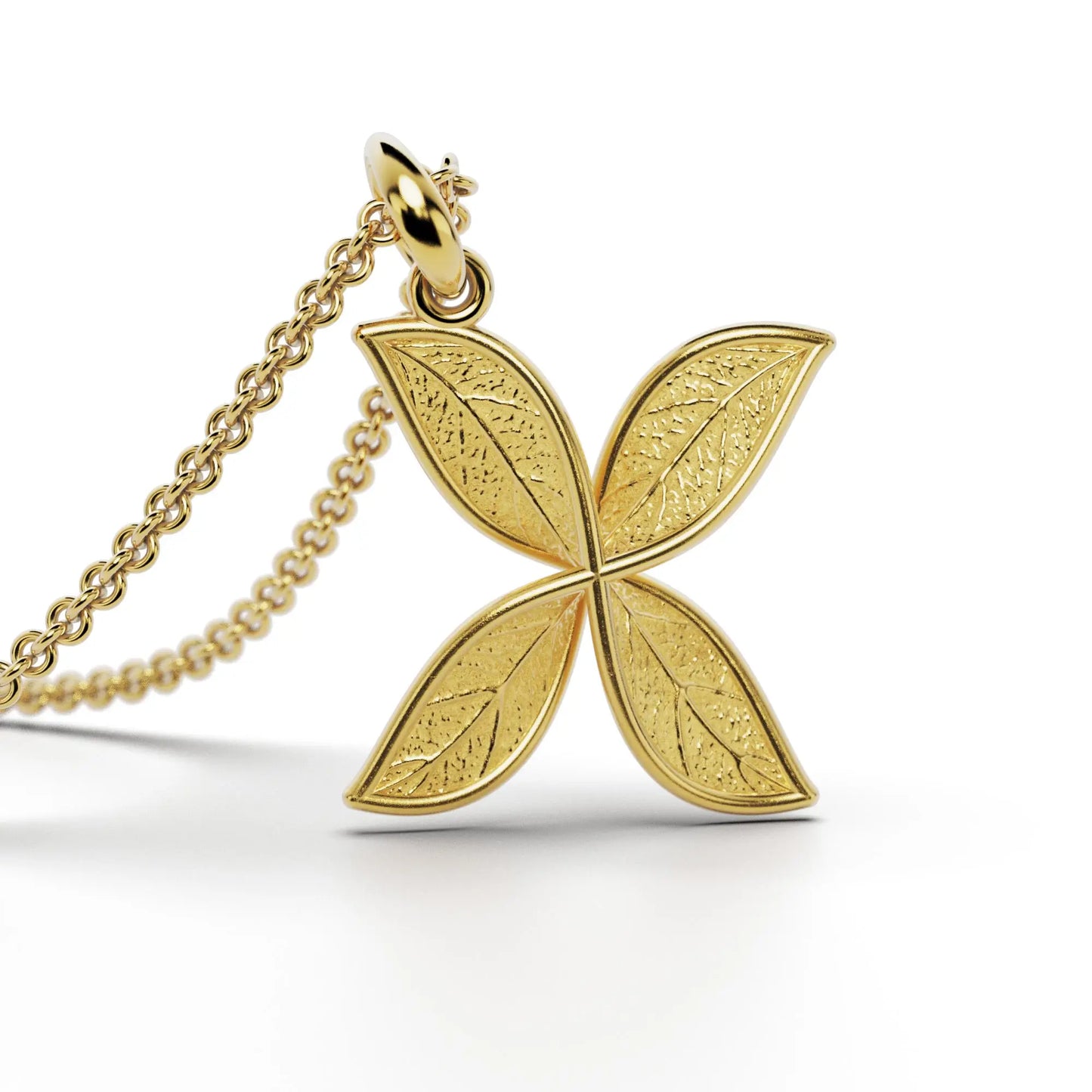 Gold initials pendant with leaf texture, custom made in Italy.
Letter X