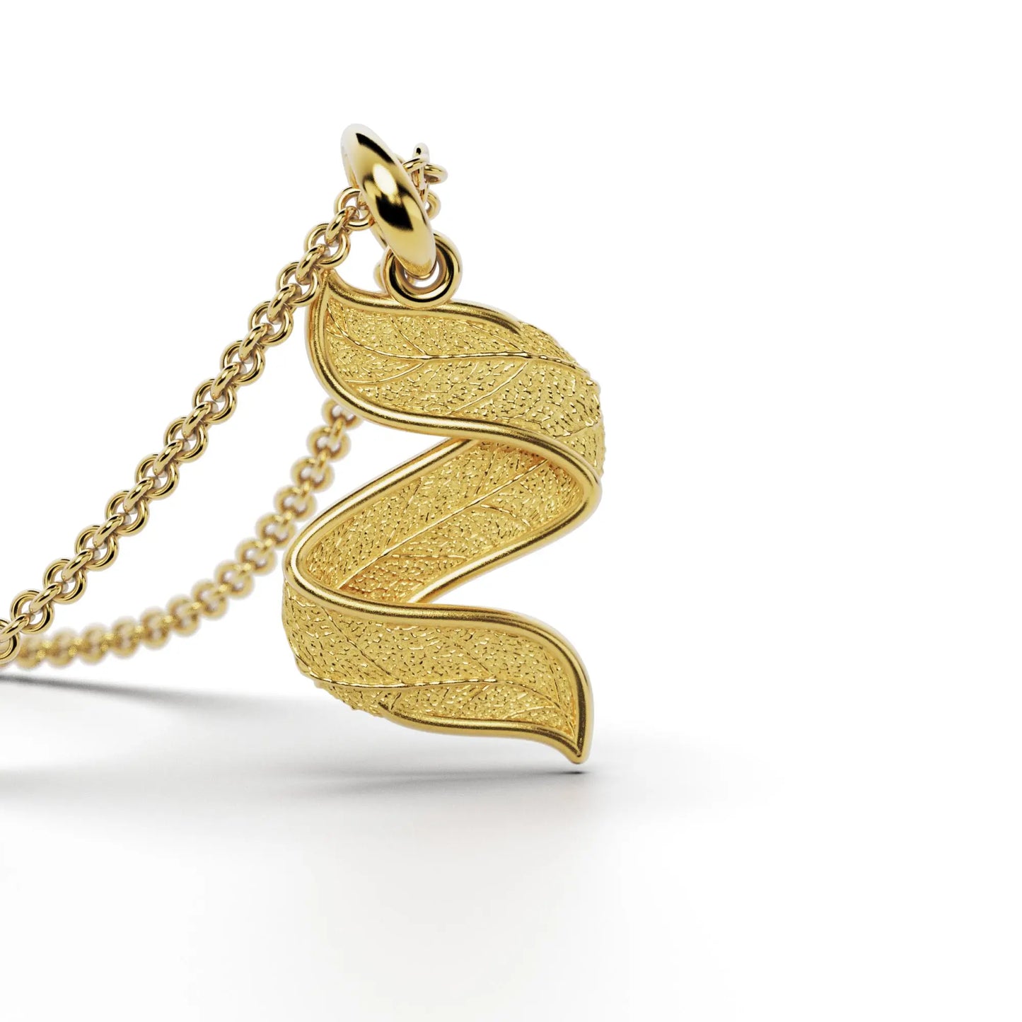 Gold initials pendant with leaf texture, custom made in Italy.
Letter Z