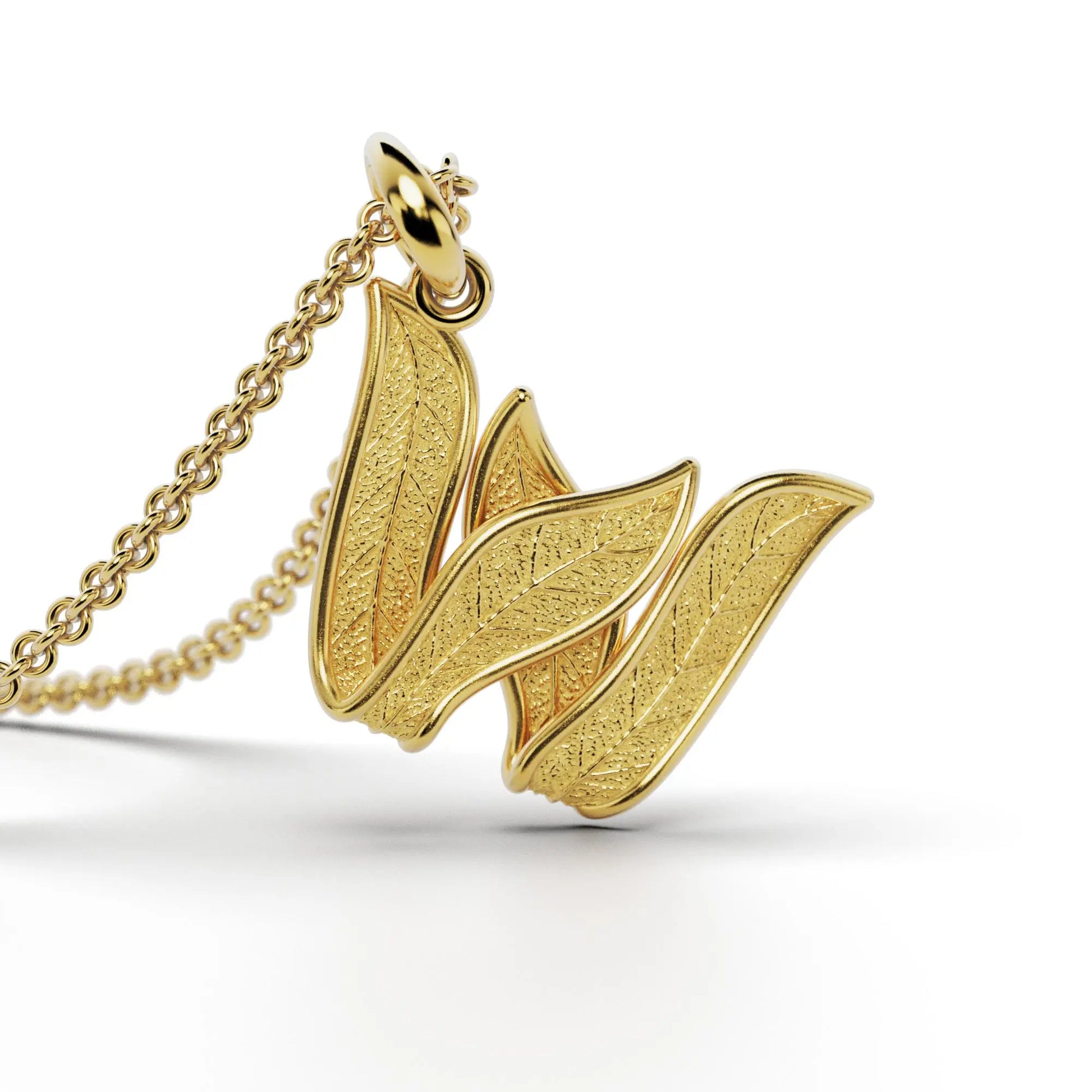 Gold initials pendant with leaf texture, custom made in Italy.
Letter W