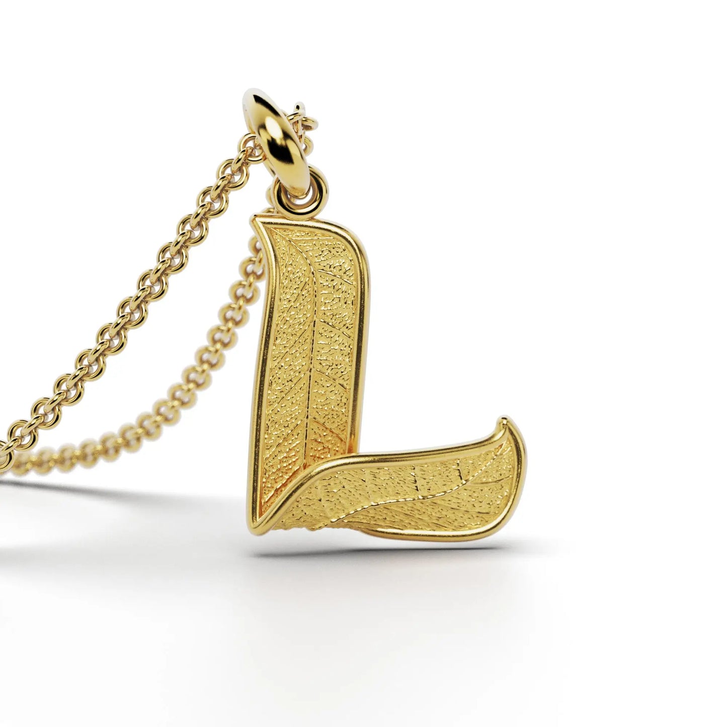 Gold initials pendant with leaf texture, custom made in Italy.
Letter L