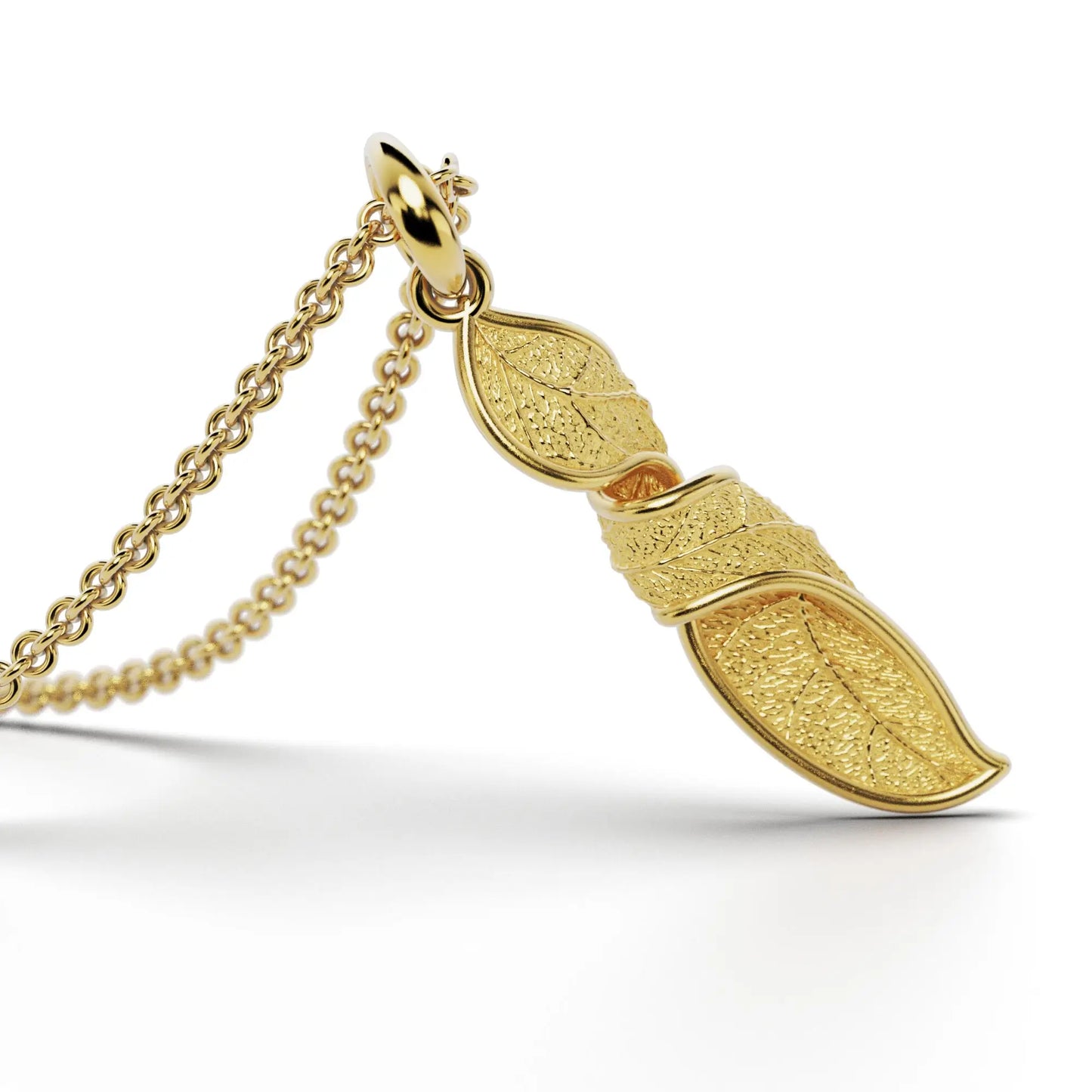 Gold initials pendant with leaf texture, custom made in Italy.
Letter I