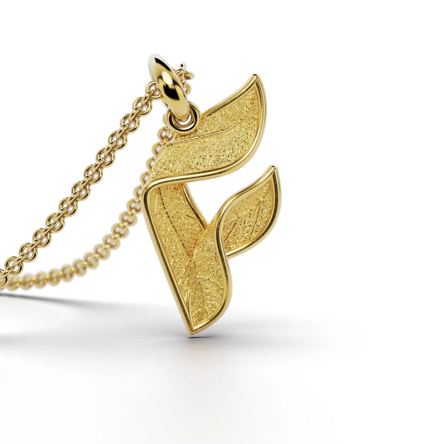 Gold initials pendant with leaf texture, custom made in Italy.
Letter F