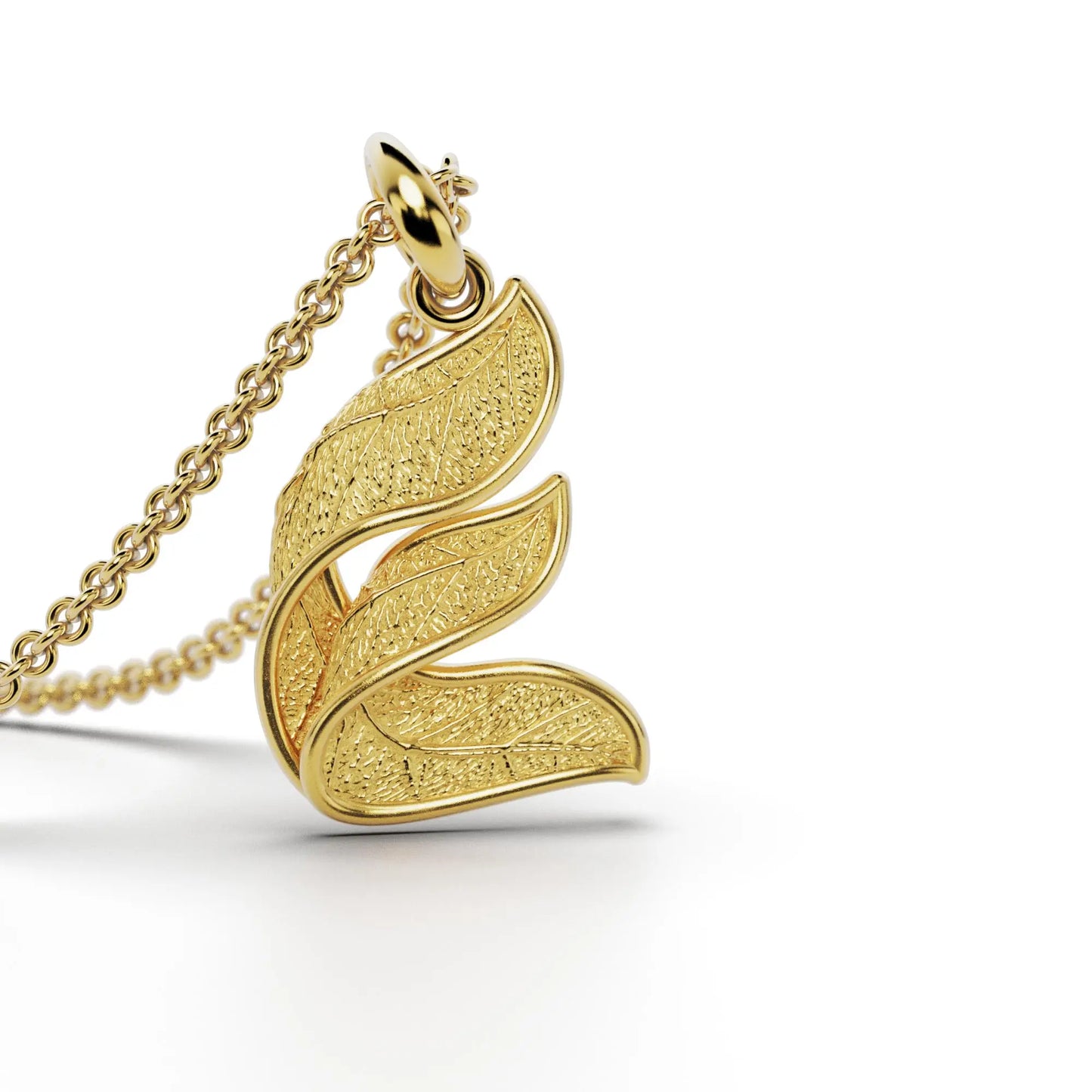 Gold initials pendant with leaf texture, custom made in Italy.
Letter E