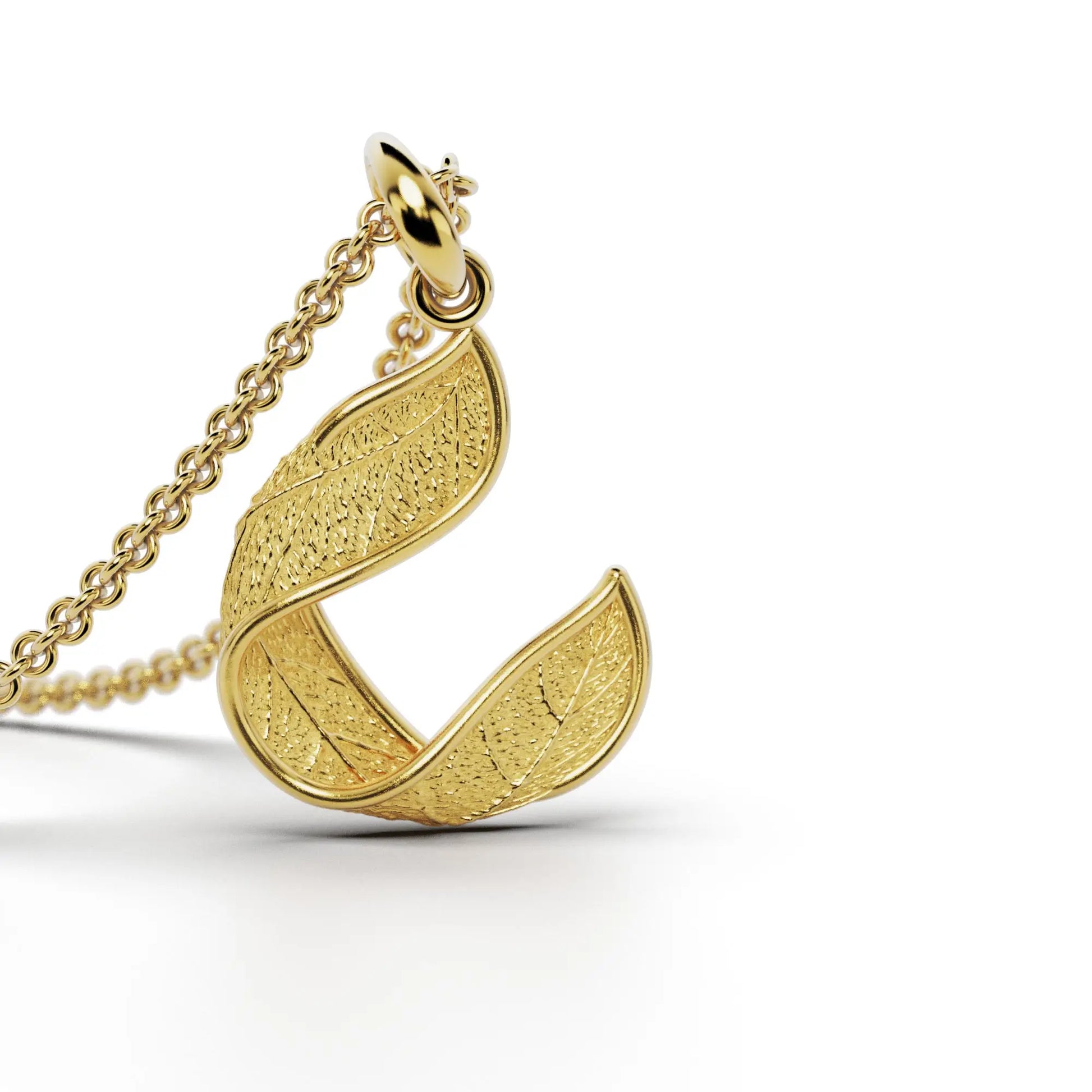 Gold initials pendant with leaf texture, custom made in Italy.
Letter C