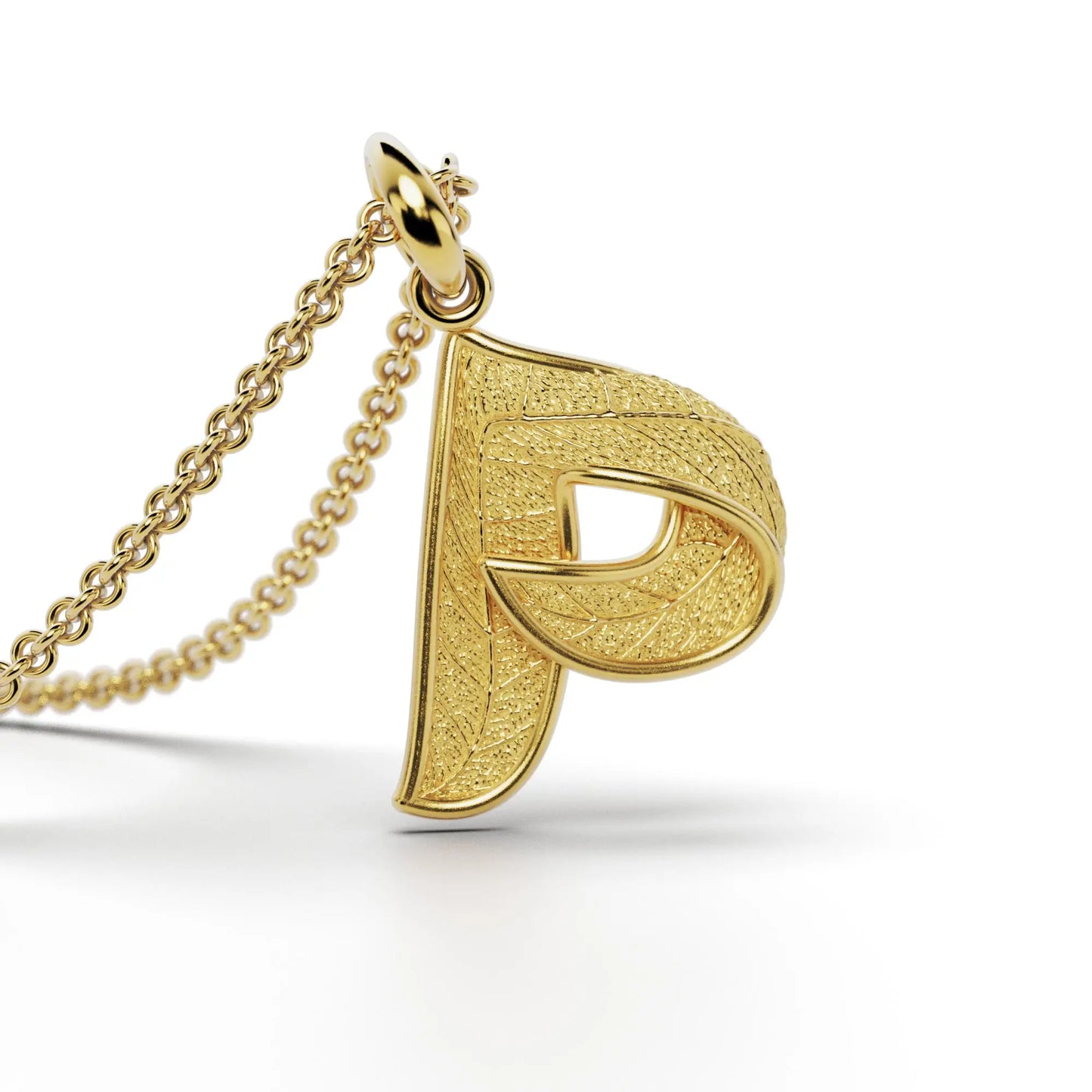 Gold initials pendant with leaf texture, custom made in Italy.
Letter P