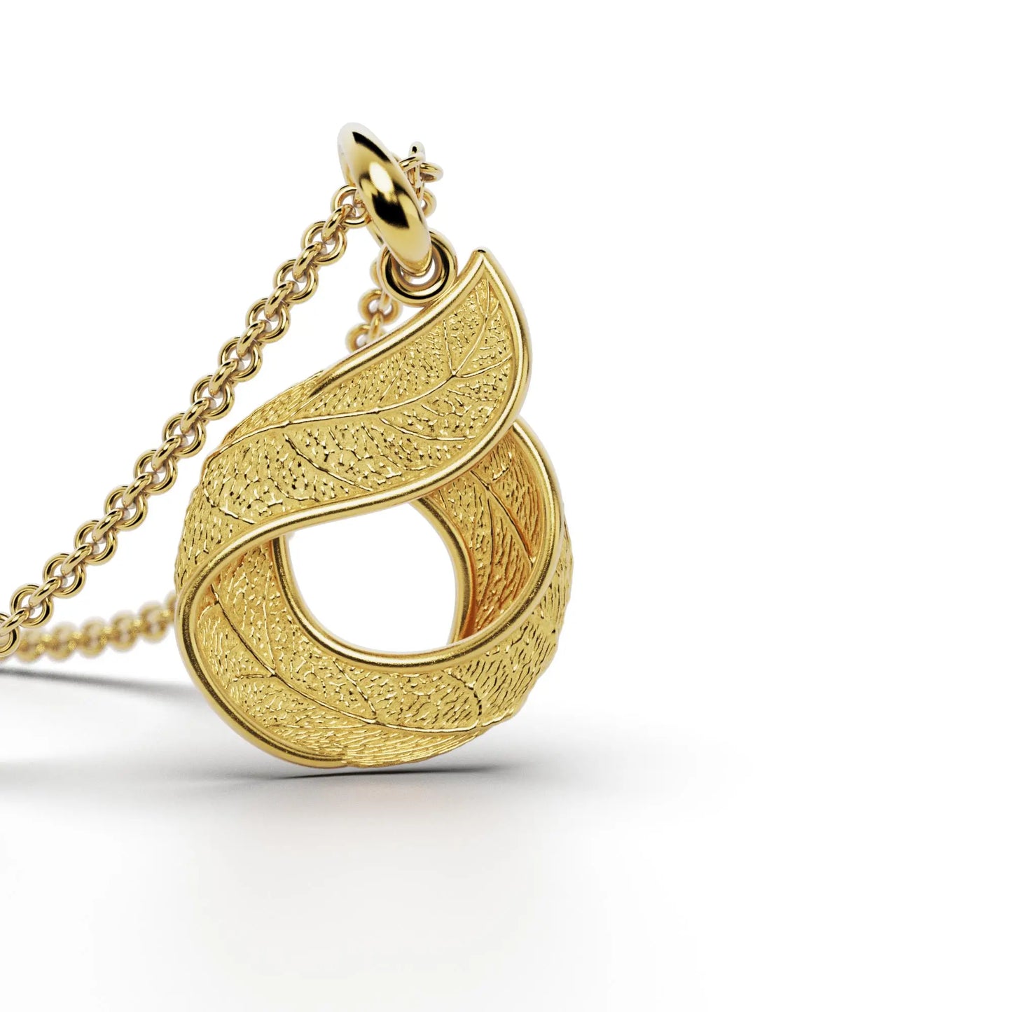 Gold initials pendant with leaf texture, custom made in Italy.
Letter O