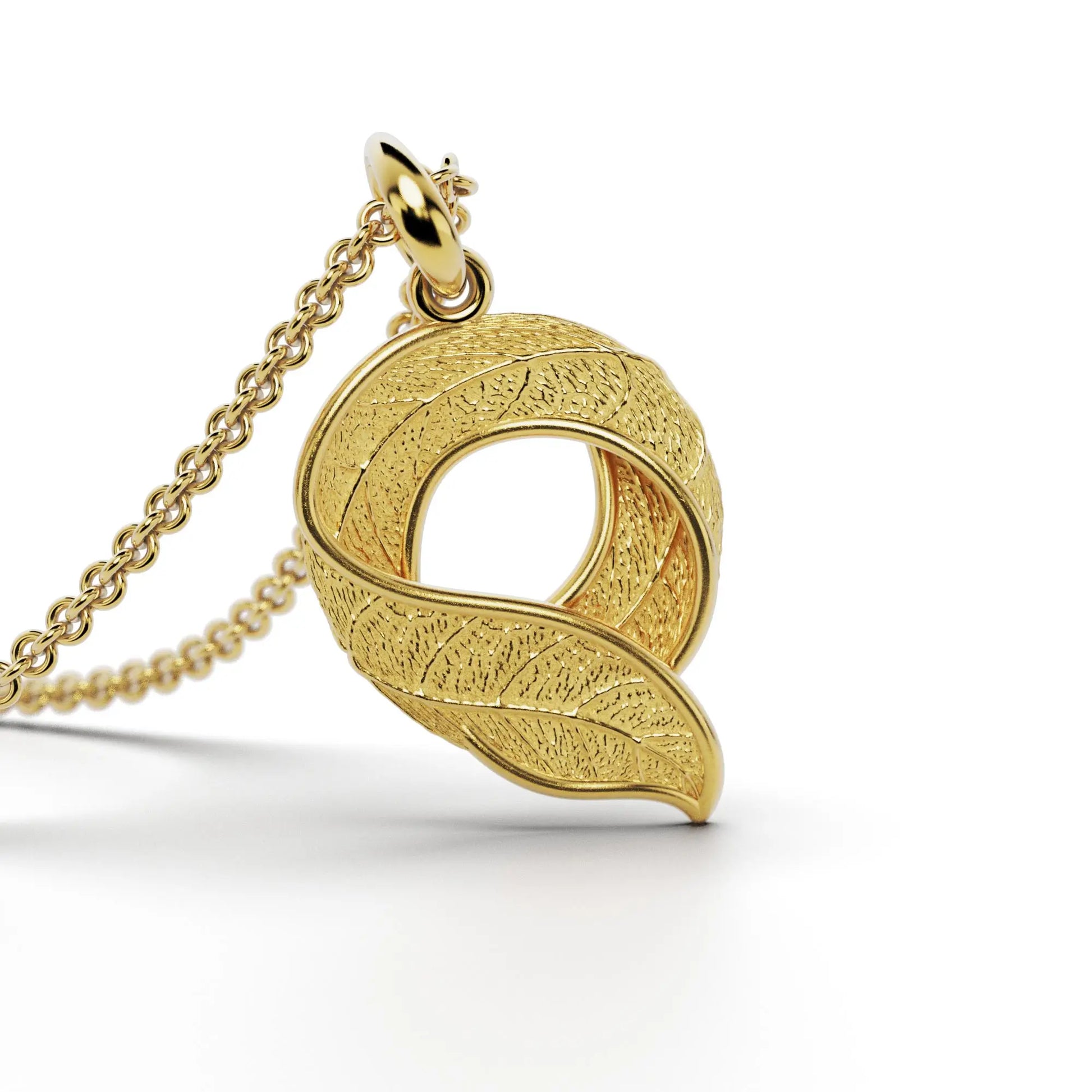 Gold initials pendant with leaf texture, custom made in Italy.
Letter Q