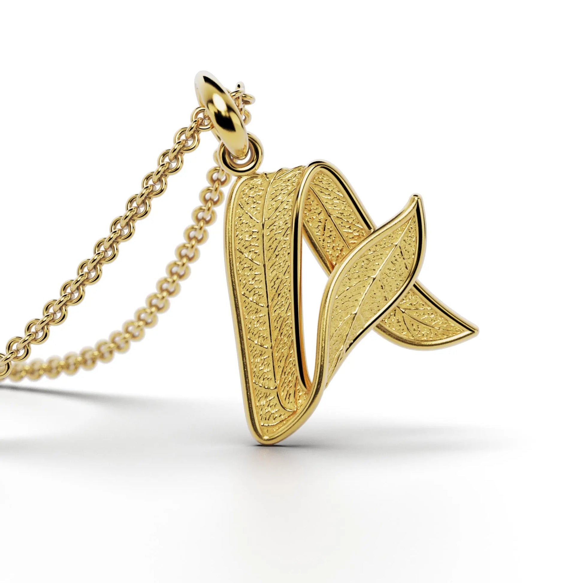 Gold initials pendant with leaf texture, custom made in Italy.
Letter A