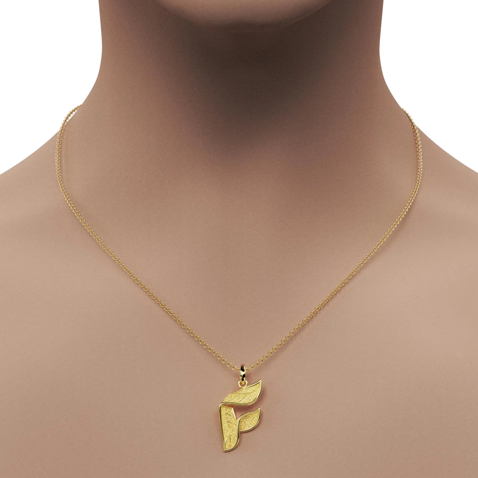 Gold initials pendant with leaf texture, custom made in Italy.
Letter F