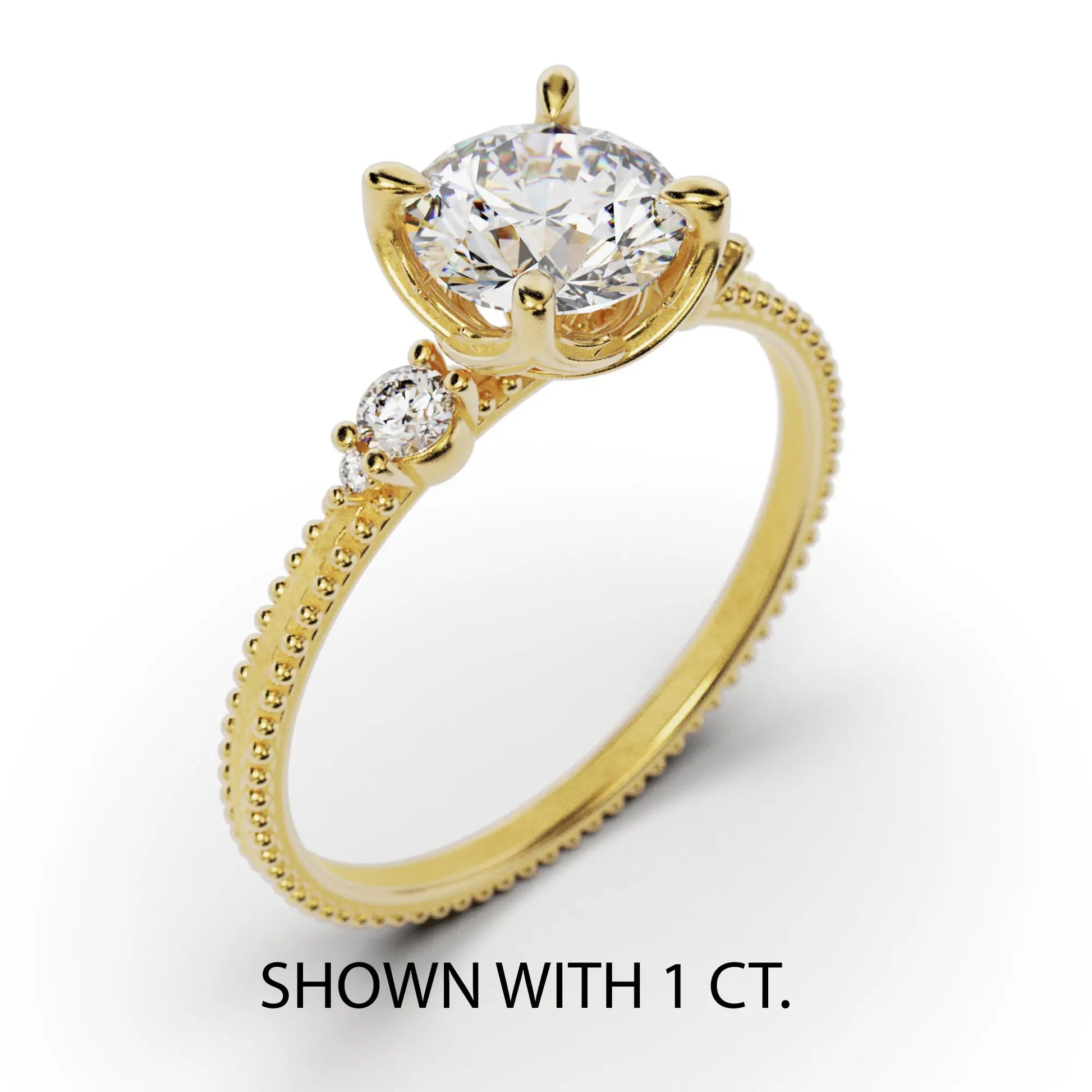 A solitaire diamond ring from the Amore collection, featuring a round-cut diamond in a Venetian-style four-pronged setting. The gold band, available in 14 or 18K, is detailed with milgrane and accented with four smaller diamonds, inspired by Venetian architecture’s timeless romance and artistry.