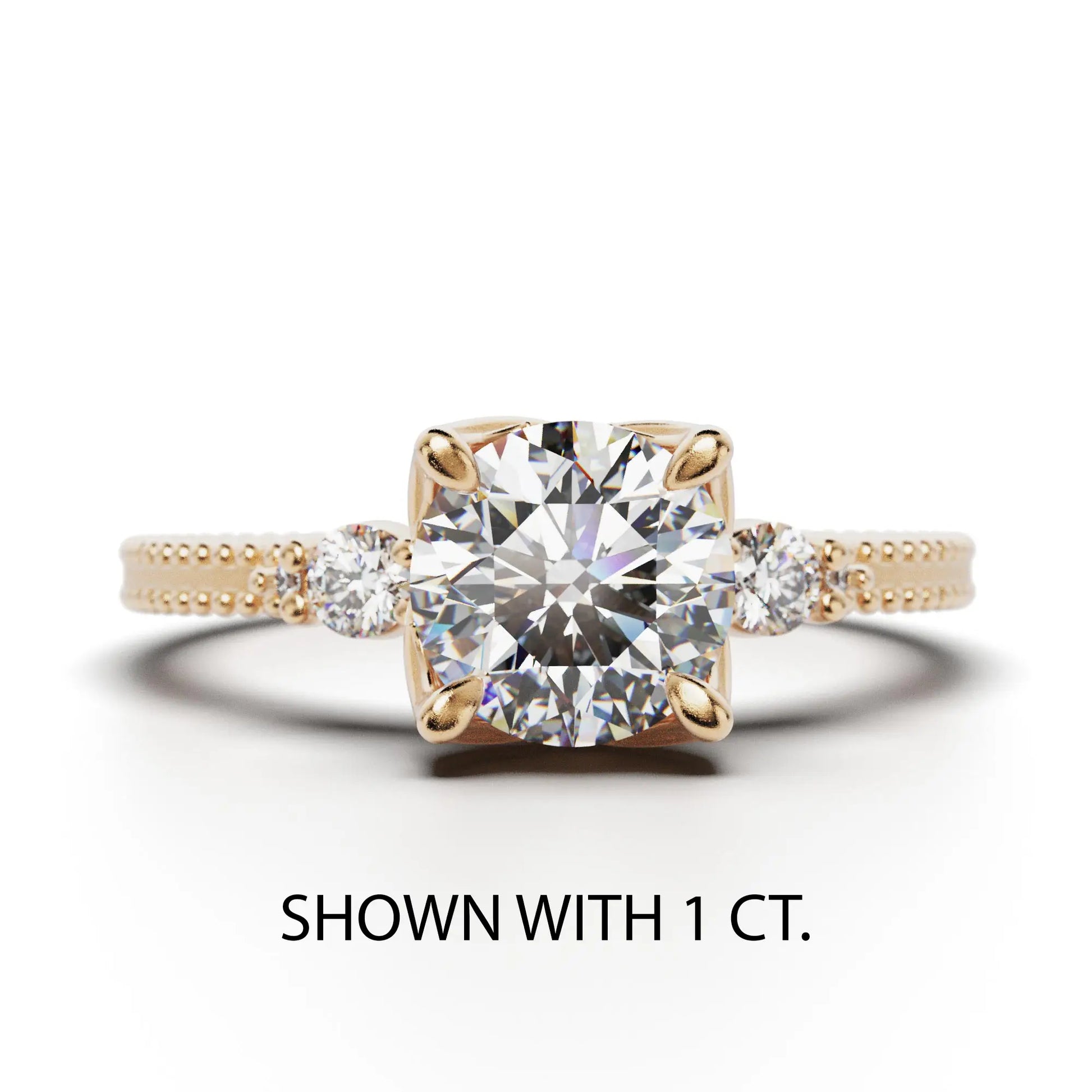 A solitaire diamond ring from the Amore collection, featuring a round-cut diamond in a Venetian-style four-pronged setting. The gold band, available in 14 or 18K, is detailed with milgrane and accented with four smaller diamonds, inspired by Venetian architecture’s timeless romance and artistry.