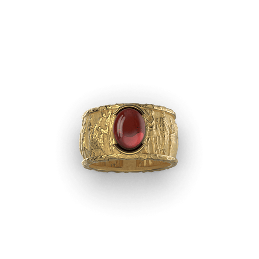 Oval Mozambique garnet set in 14k yellow gold band