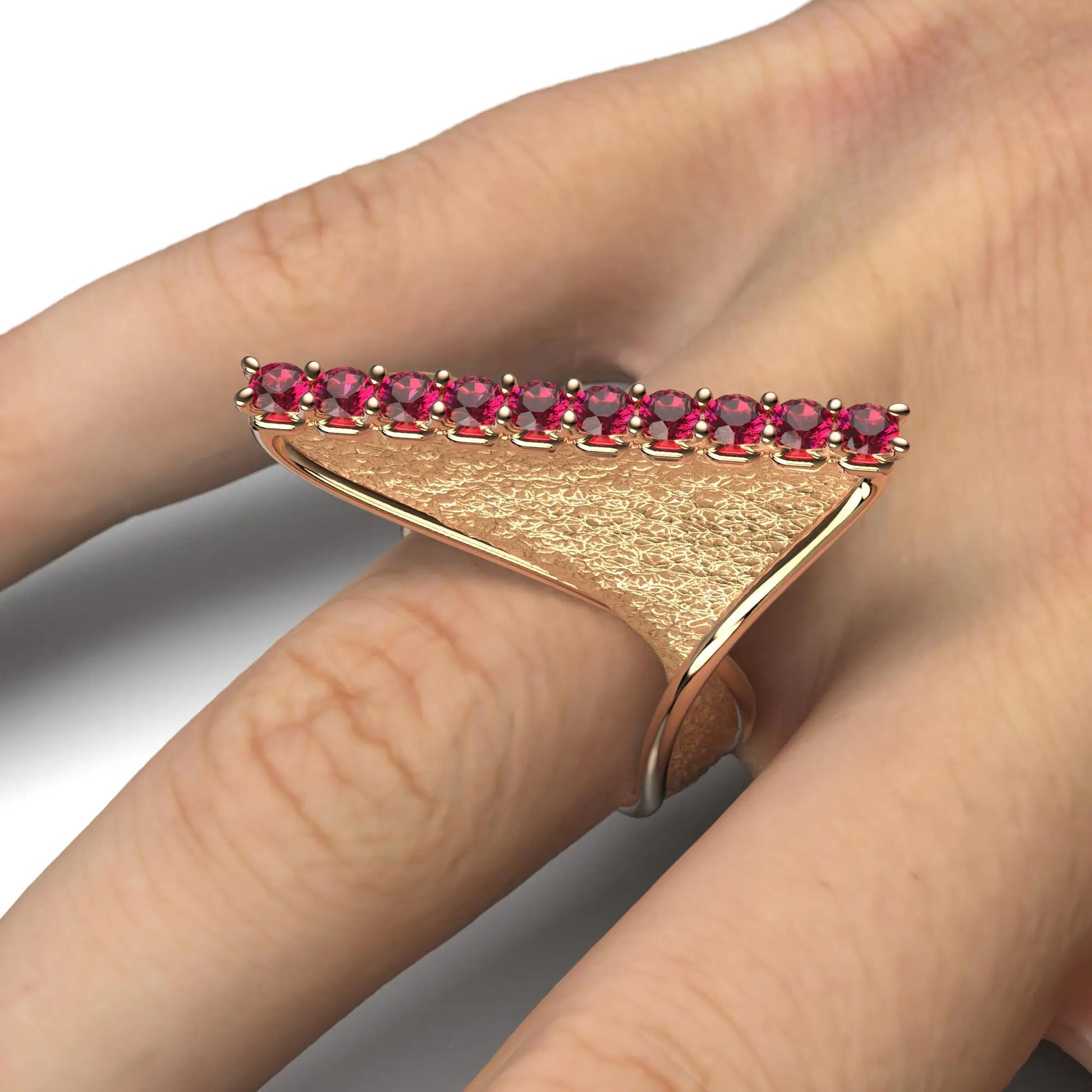 
A modern twisted gold ring with polished edges and an earth-textured surface, featuring 10 round natural rubies set along the top ridge.