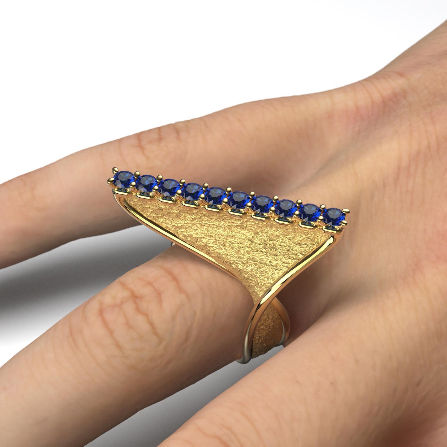 A handcrafted 18k gold ring featuring a modern twisted design with 10 round blue sapphires set along the top ridge. Polished edges with an earth-textured surface.