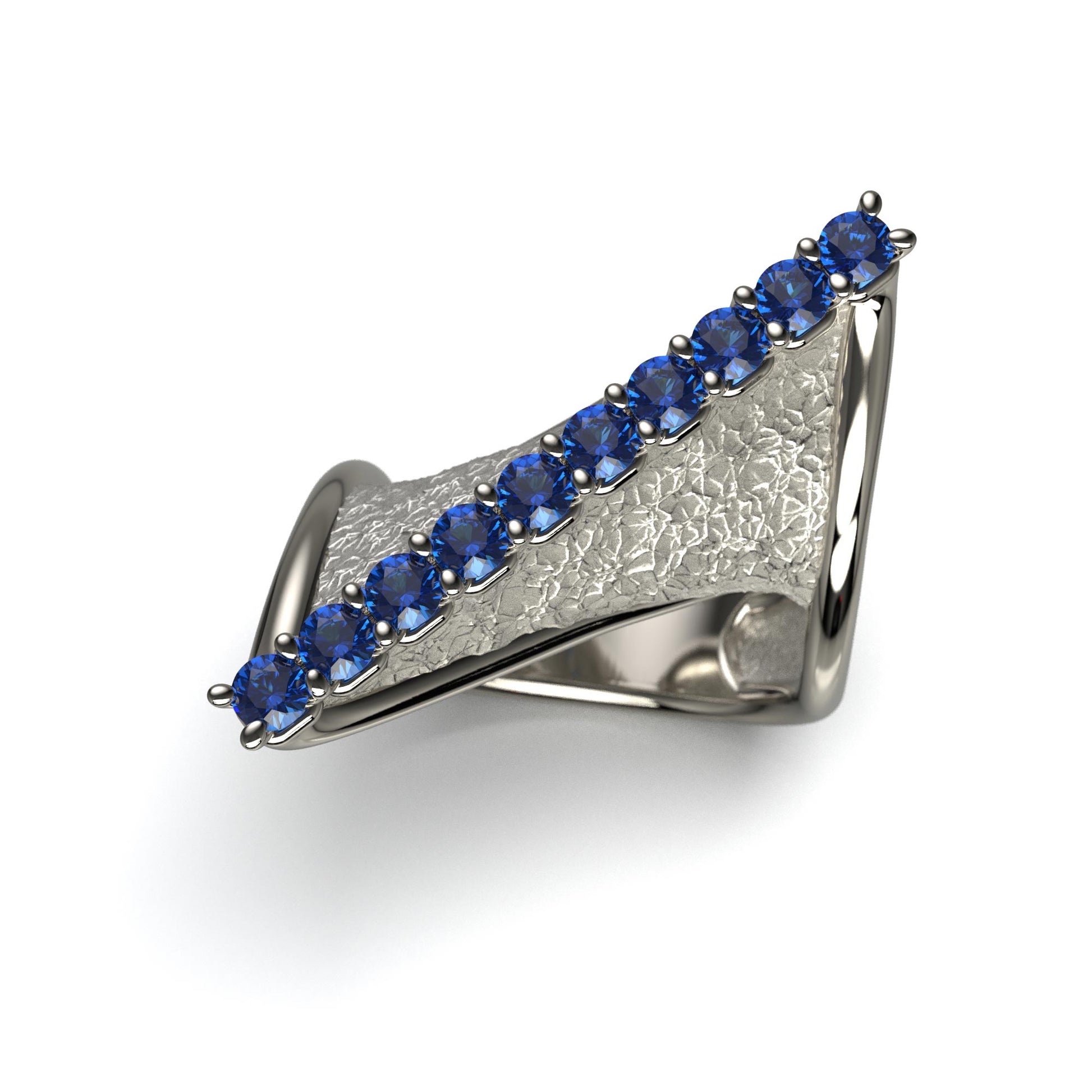 A handcrafted 18k gold ring featuring a modern twisted design with 10 round blue sapphires set along the top ridge. Polished edges with an earth-textured surface.