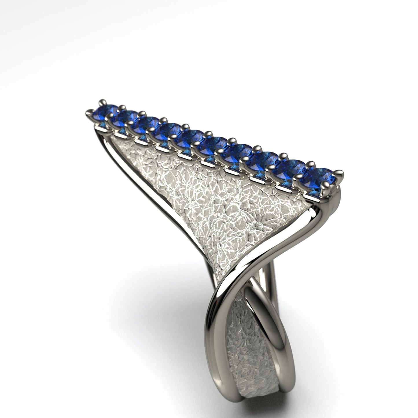 A handcrafted 18k gold ring featuring a modern twisted design with 10 round blue sapphires set along the top ridge. Polished edges with an earth-textured surface.