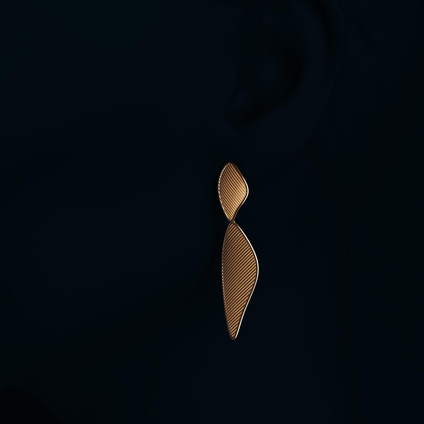 Modern dangle drop earrings in 14k or 18k gold, featuring a ribbed texture and polished edges. Shown in yellow, rose, and white gold variations, measuring 57 mm in length and 19 mm in width.