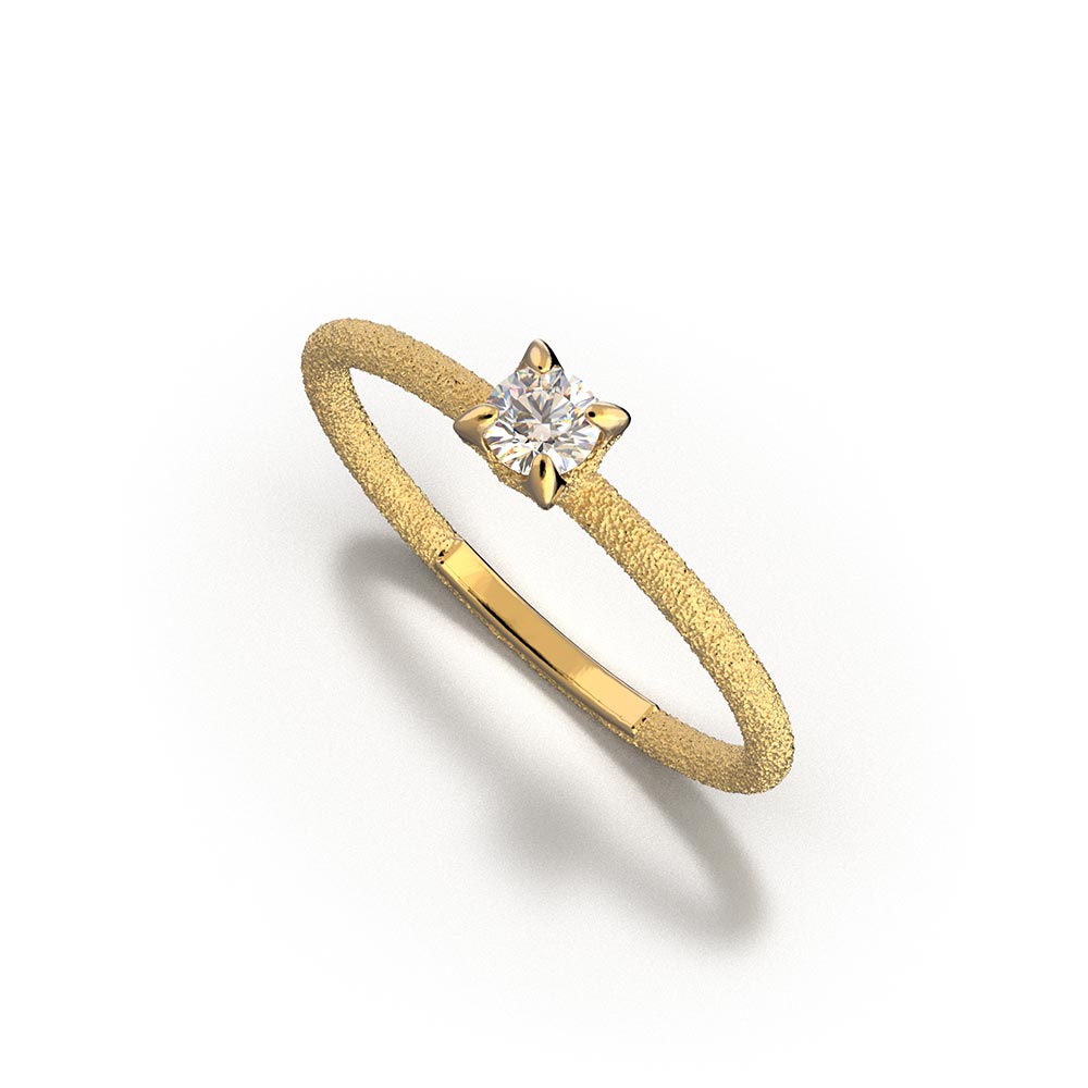 A stunning Italian handmade ring featuring a round, natural white diamond, measuring approximately 3.5mm in diameter and weighing 0.16 carats. The diamond is set on a sleek, handcrafted 18k or 14k solid gold band, meticulously textured to create a striking sparkle effect. The band is approximately 1.6mm wide and 1.6mm thick, enhancing the diamond's brilliance.